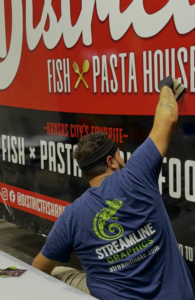 Streamline Graphics technician installing vehicle graphics in Kansas City